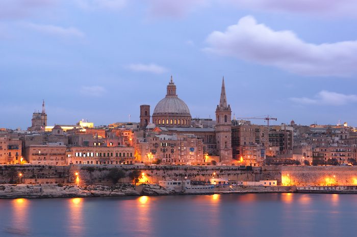 night view of Valletta with the St. Pauls Cathedral and Charmelite Church at the twilight