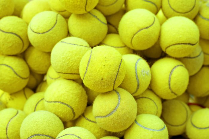 exotic yellow tennis ball as sport background