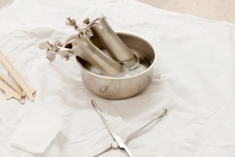 Vaginal Speculum sterilized in alcohol on Medical instruments table. Cervical Screening.