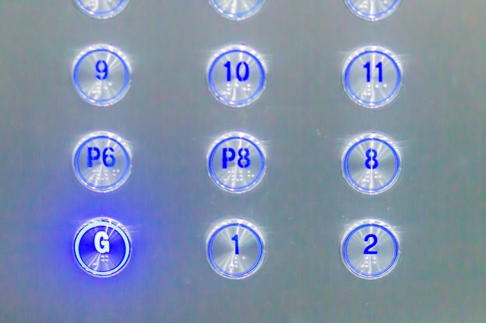 Blue elevator buttons pressed G lift down to ground floor