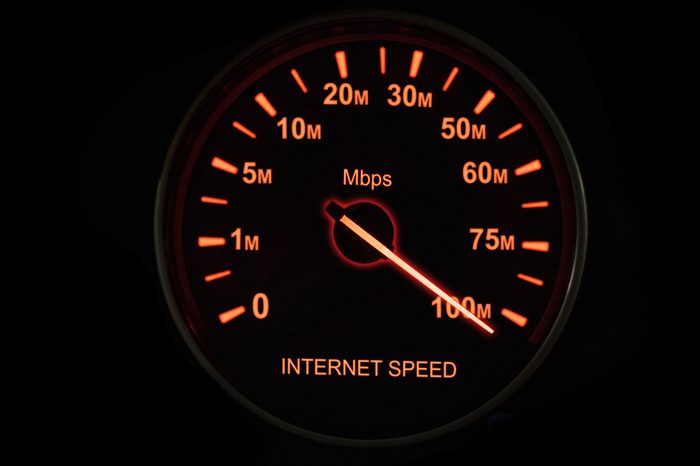 Close up of internet speed test with speedometer and speed up to 100 Mbps