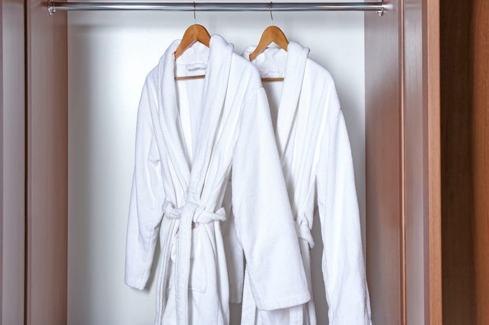 Spa bathrobes hanging in wardrobe