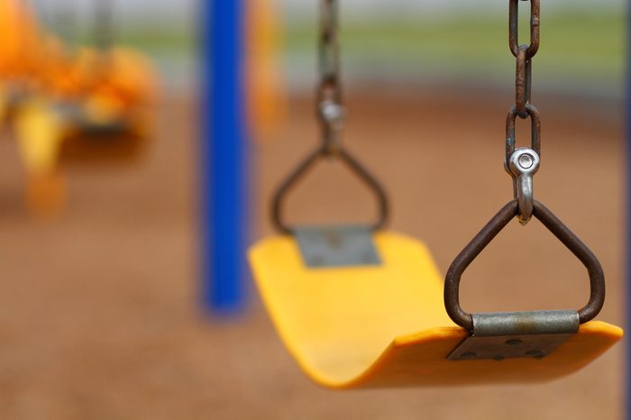 Playground swing set (selective focus)