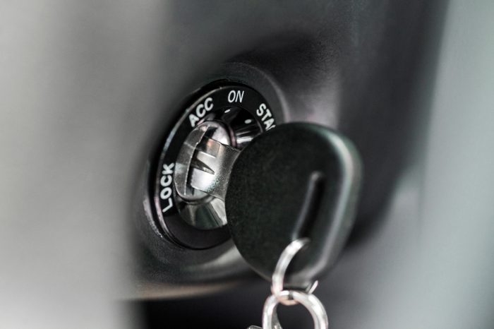 Close up of car key in keyhole for ignition. Car keys in ignition about to start the car. Macro of modern start car key