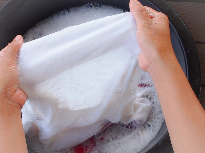 Woman hand washing clothes 
