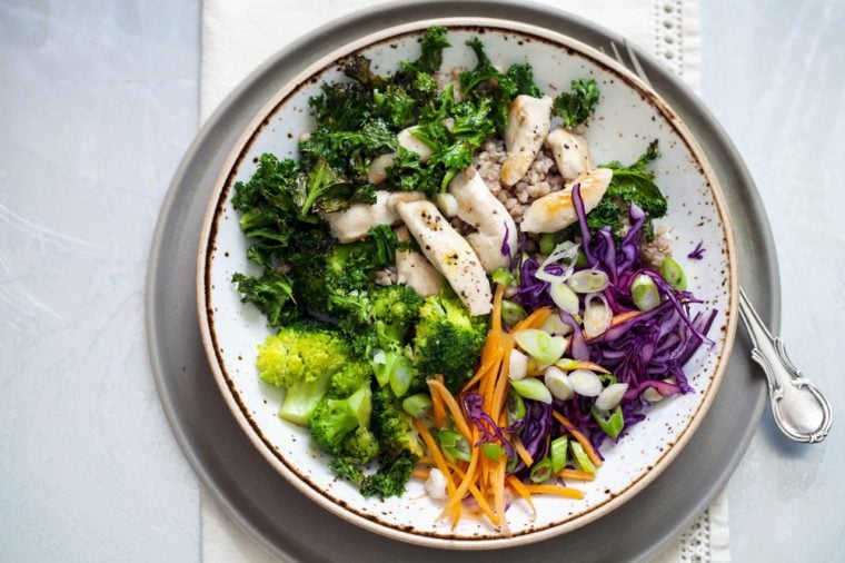 Healthy salad with buckwheat, chicken, broccoli, crispy kale and red cabbage