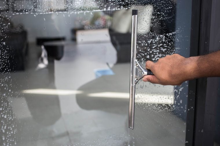 Cleaning windows with a squeegee
