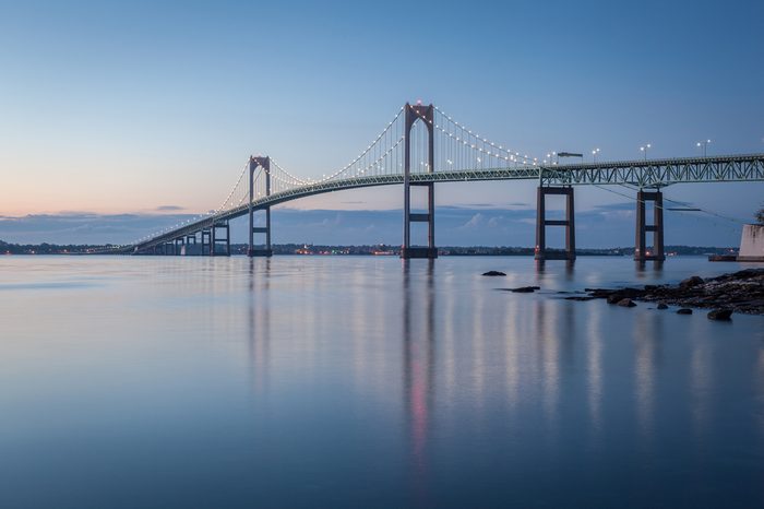 Newport Bridge Twilight Sunrise / This is a long exposure morning sunrise image of the Newport Bridge from Taylor Point near Jamestown, Rhode Island, USA. This is a horizontal image.