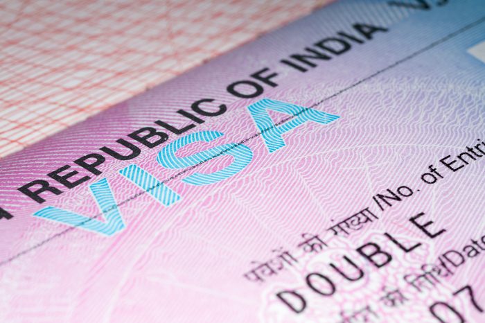Visa to India. Close-up of visa to Republic of India in passport. Selective focus