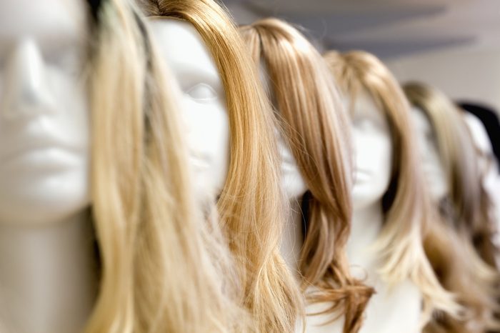 Row of Mannequin Heads with Wigs on the Shelf