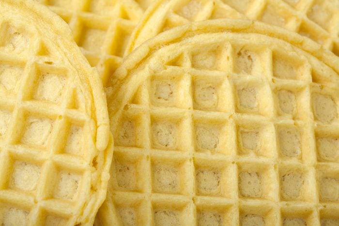 Frozen buttermilk waffles background; close up view