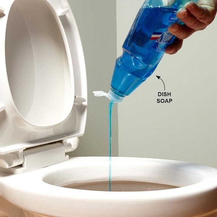 Unclog a toilet with dish soap