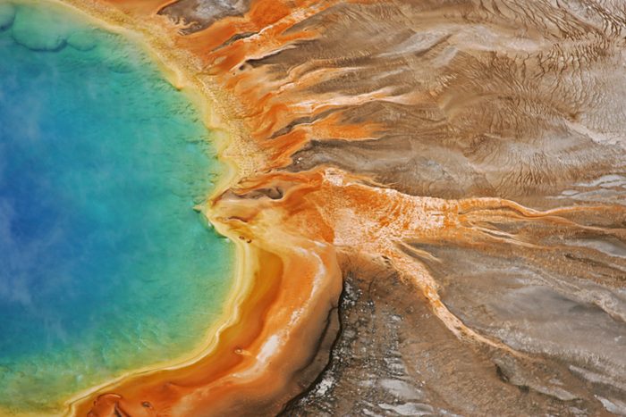 An aerial view of a section of Grand Prismatic Spring, Yellowstone National Park that looks like lava on another planet