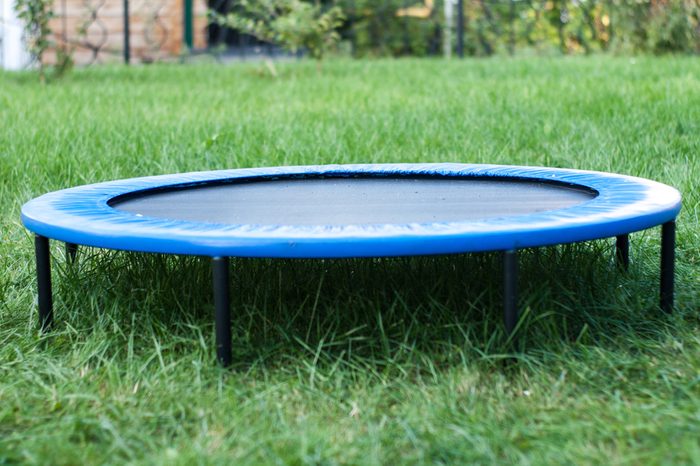 A Round Trampoline on the Back Yard Grass