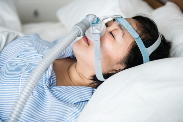 A woman wearing anti-snoring chin straps