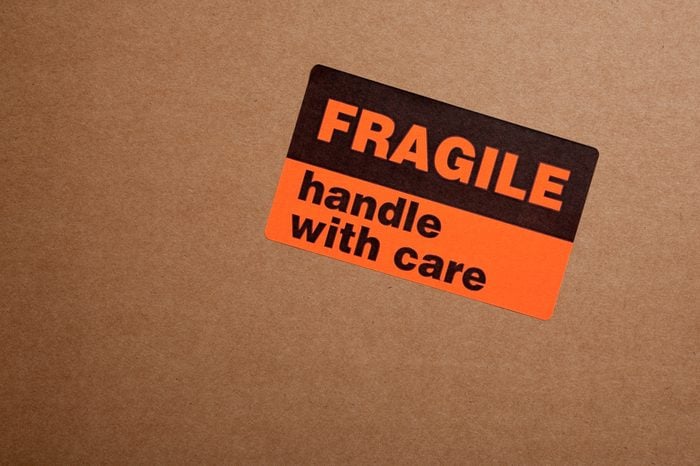 Moving boxes with fragile sticker on a white background