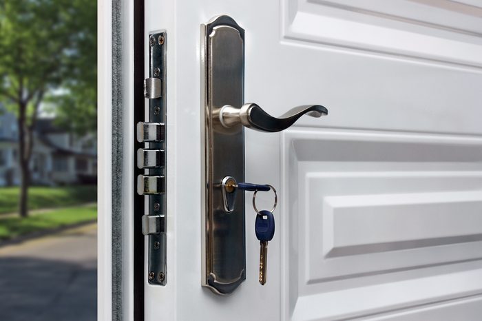 Open door of a family home. Close-up of the lock with your keys on an armored door. Security.