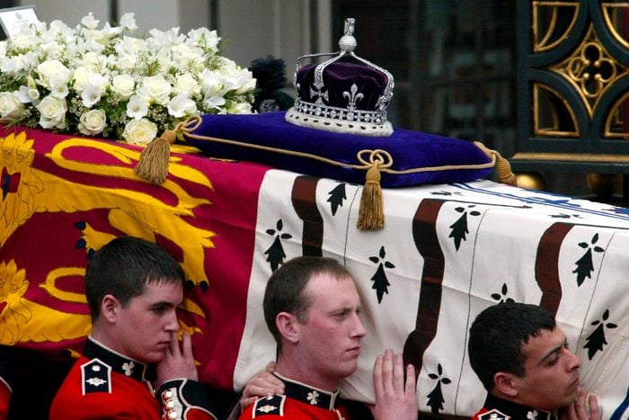 men carrying a royal casket