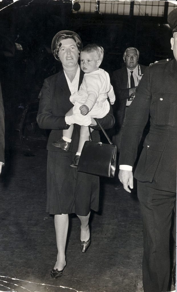 Prince Edward 17 Months Old Youngest Son Of Queen Elizabeth Ii Being Carried By His Nanny At Kings Cross Station......