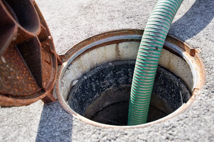Emptying septic tank, cleaning the sewers. Septic cleaning and sewage removal. Emptying household septic tank. Cleaning sludge from septic system.