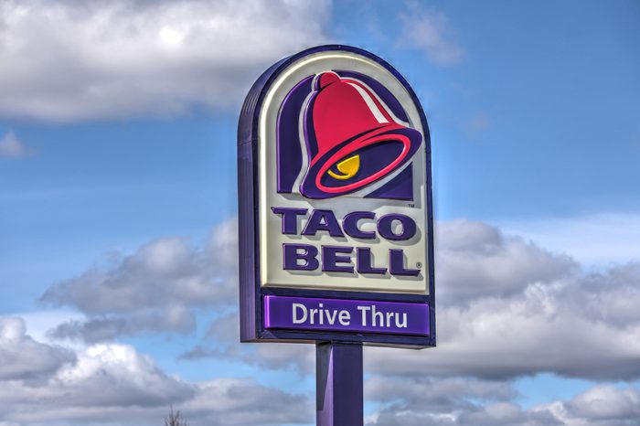 HDR image, Taco Bell restaurant, drive thru highway sign - Revere, Massachusetts USA - March 10, 2018