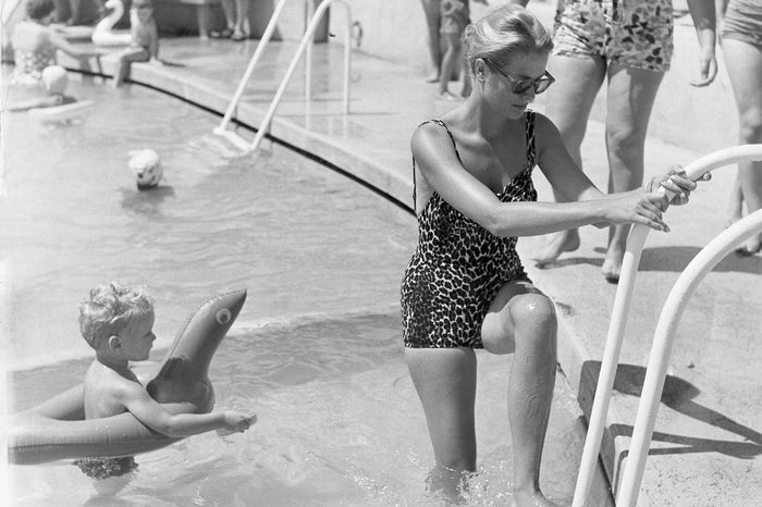 Princess Grace Of Monaco With Her Son Prince Albert At The Swimming Pool On Monaco Beach In 1960. Grace Kelly