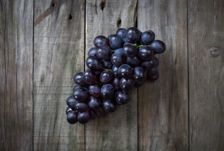 grapes on a wood surface