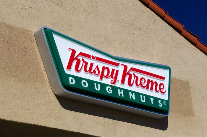 LOS ANGELES, CA/USA - November 11, 2015: Krispy Kreme Doughnuts exterior and logo. Krispy Kreme Doughnuts, Inc. is an American global doughnut company and coffeehouse chain.