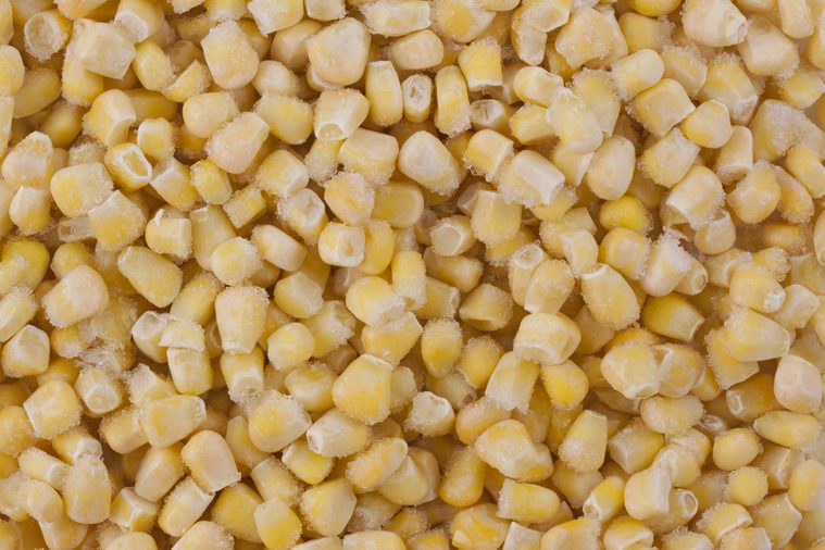 background of frozen and frosty yellow corn kernels