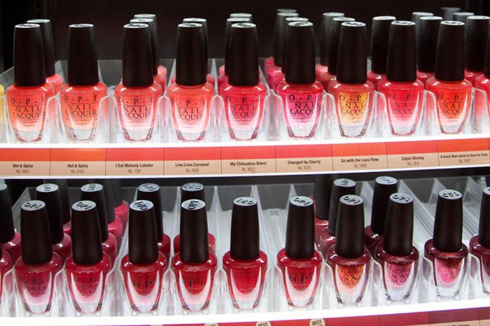 Nail polish rack. Shelf of cosmetic products. Airport duty free shop. Image from within the store. Sabiha Gokcen Airport. Pendik. Istanbul. Turkey. December 2017.