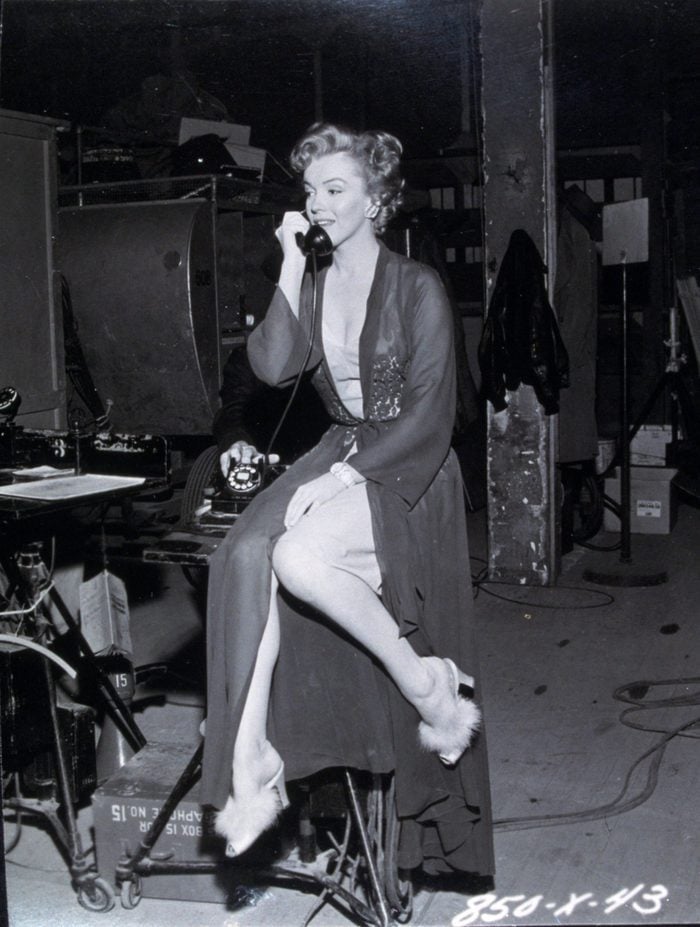 VARIOUS FILM STILLS OF 'DON'T BOTHER TO KNOCK' WITH 1952, MARILYN MONROE, MOVIE SET, TELEPHONING, STOOL, SITTING, SHOES, FUR, LEGS, LINGERIE IN 1952