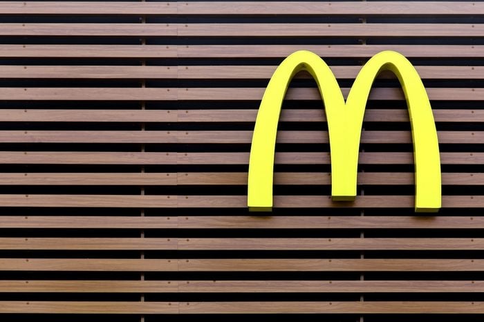 Vejle, Denmark - July 4, 2015: Mc Donald's logo on a striped facade