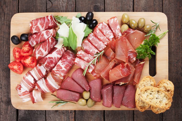 Charcuterie board with prosciutto, capicola and other italian deli cured meat