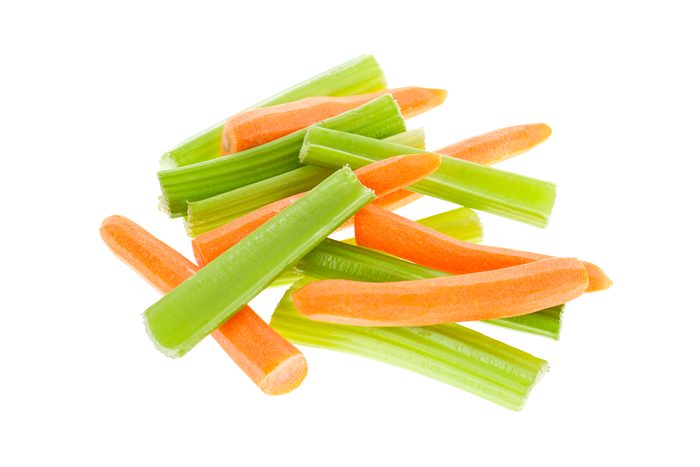 Carrots and celery isolated on white