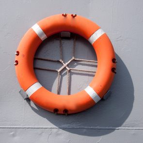 An orange safety ring float hanged