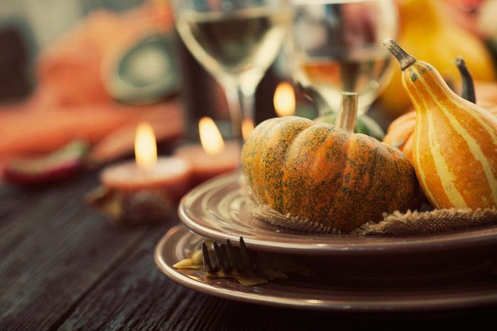 Autumn table setting with pumpkins. Thanksgiving dinner and autumn decoration.