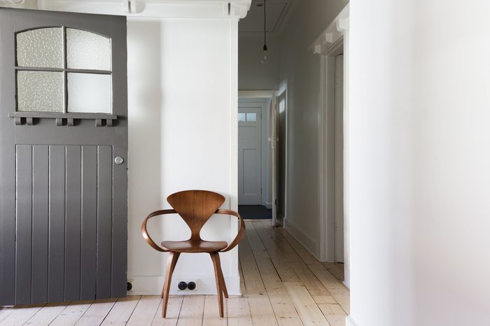 Simple decor of classic wooden chair in renovated apartment entry horizontal