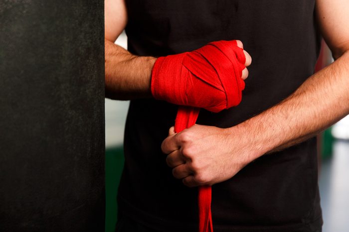 Hands athlete with wrist wraps