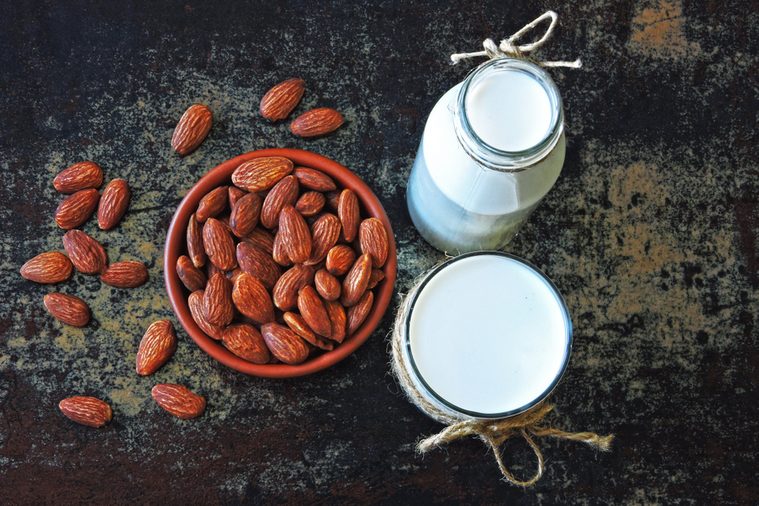 Almond milk and almonds. The concept of cooking almond milk. Vegan milk.