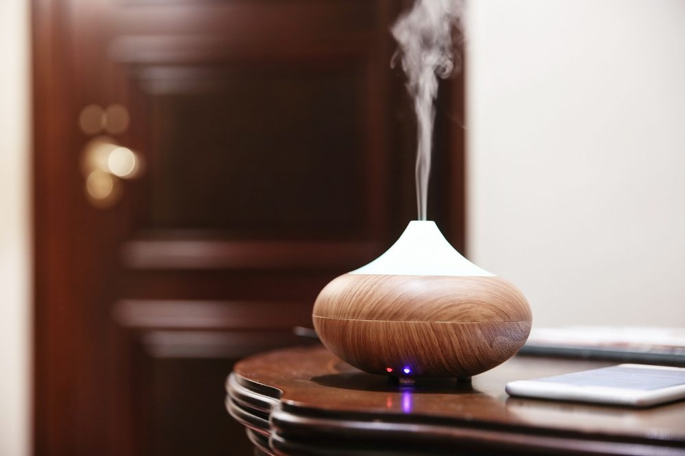 Aroma oil diffuser on table im room