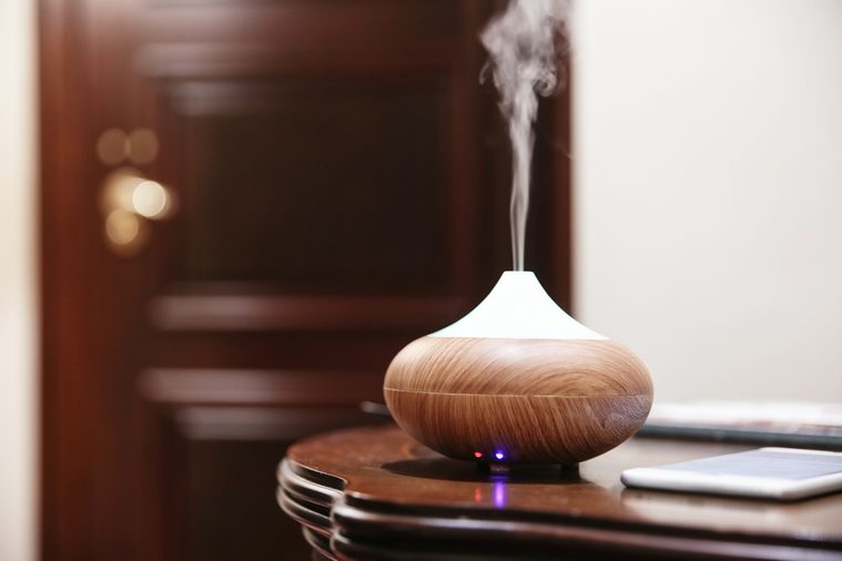 Aroma oil diffuser on table im room