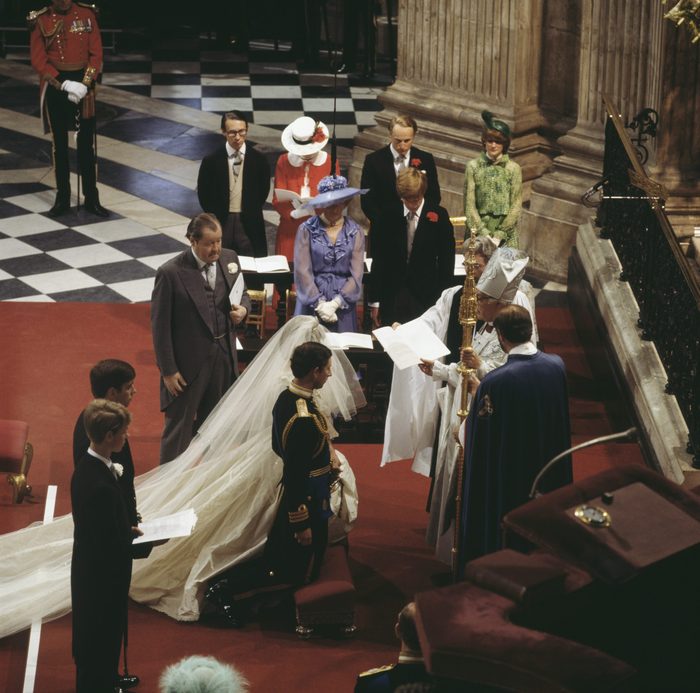 Prince Andrew and Prince Edward are behind their brother Charles, and John Spencer, 8th Earl Spencer, gives his daughter away. Behind them are Diana's mother, Frances Shand Kydd, her brother Charles, and her sisters Jane Fellowes and Sarah McCorquedale. Robert Runcie, the Archbishop of Canterbury, conducts the ceremony.