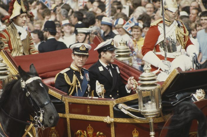 Prince Charles (left) and his brother Prince Andrew arrive in a carriage for Charles's wedding