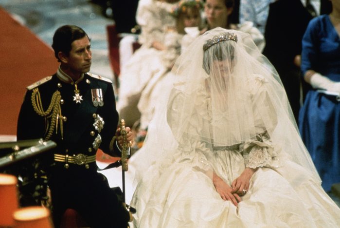 Photo of Prince Charles and Lady Diana Spencer, shown seated during their wedding ceremony