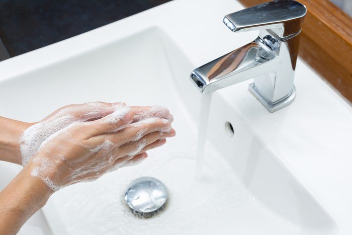 Clean hands by washing hands with soap