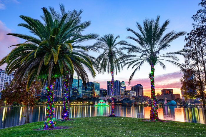 Orlando, Florida, USA downtown skyline at Eola Lake.