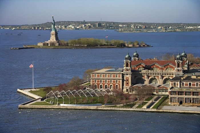 Aerial view of Ellis Island with Statue of Liberty, New York City.