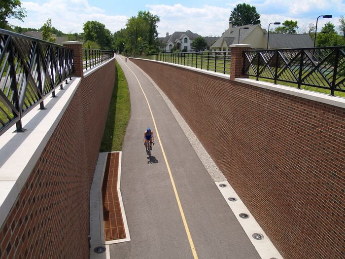 Man riding his bike on the Monon Greenway Trail in Carmel, Indiana.