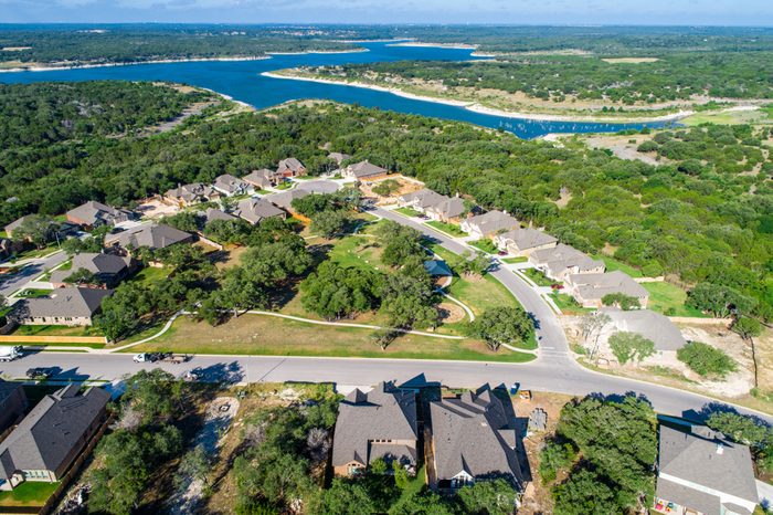 Lake view homes Georgetown , Texas Aerial drone view above suburb development with amazing view of Georgetown Lake and surround Texas Hill Country with homes and houses