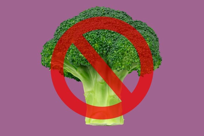 Broccoli on purple background with cancel sign over it